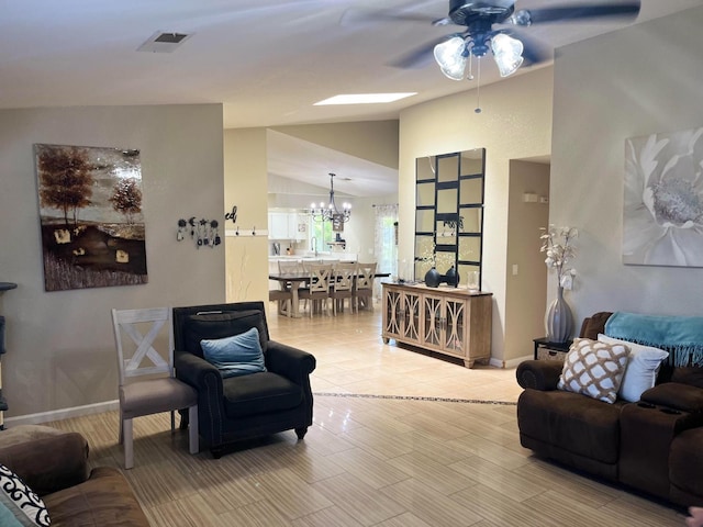 1561 Josephine Ct, Madera, CA 93638 - living room featuring ceiling fan, lofted ceiling, a chandelier, baseboards, and light tile patterned floors