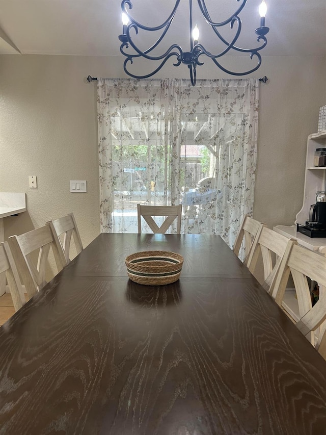 1561 Josephine Ct, Madera, CA 93638 - dining room with a chandelier and a textured wall
