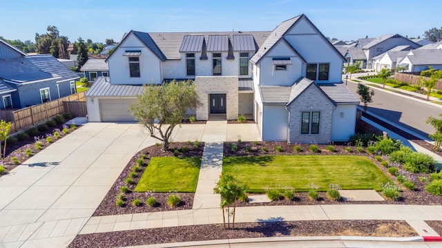 1734 Lester Ave, Clovis, CA 93619 - view of front facade with a residential view, driveway, stucco siding, an attached garage, and metal roof