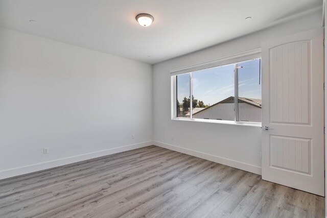 1734 Lester Ave, Clovis, CA 93619 - spare room featuring wood finished floors and baseboards