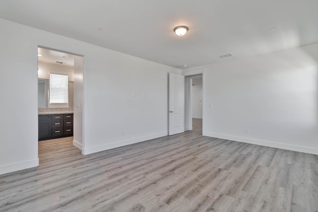 1734 Lester Ave, Clovis, CA 93619 - spare room featuring light wood-style floors and baseboards