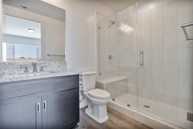 1734 Lester Ave, Clovis, CA 93619 - full bathroom with wood finished floors, a stall shower, toilet, and vanity
