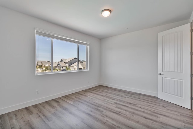 1734 Lester Ave, Clovis, CA 93619 - unfurnished room featuring wood finished floors and baseboards