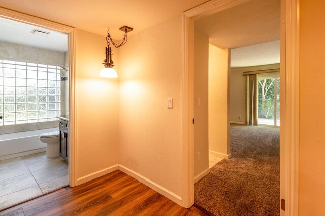 1785 W Calimyrna Ave Unit A, Fresno, CA 93711 - corridor featuring baseboards and wood finished floors