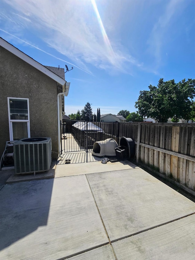 5453 N San Clemente Ave, Fresno, CA 93723 - view of patio / terrace featuring central air condition unit and a gate