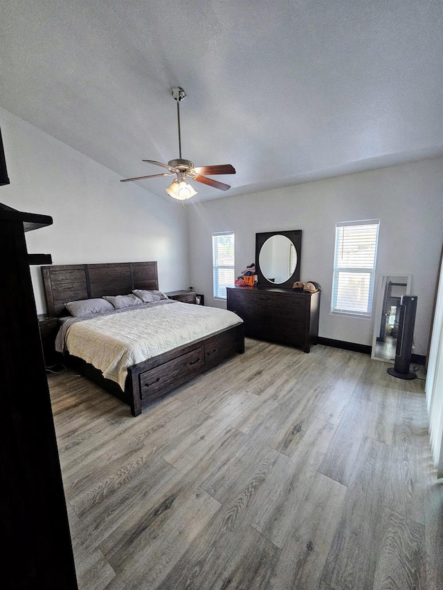 5453 N San Clemente Ave, Fresno, CA 93723 - bedroom with wood finished floors, baseboards, and ceiling fan