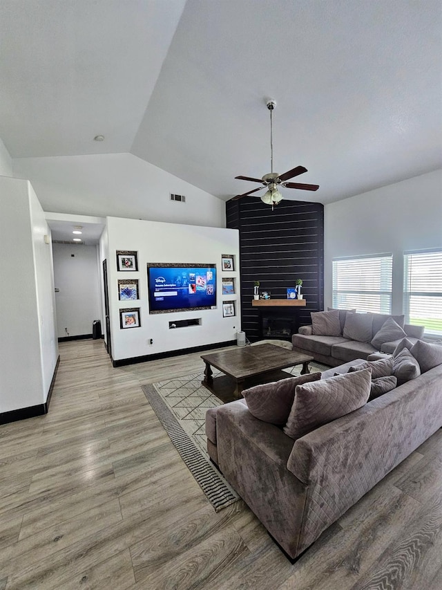 5453 N San Clemente Ave, Fresno, CA 93723 - living room with vaulted ceiling, light wood finished floors, ceiling fan, and baseboards