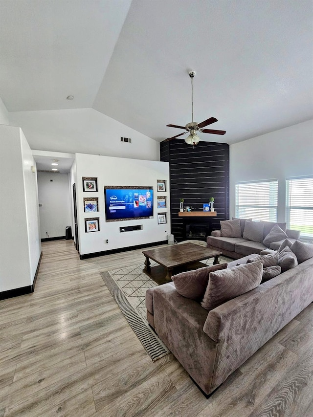 5453 N San Clemente Ave, Fresno, CA 93723 - living area with vaulted ceiling, ceiling fan, light wood finished floors, and baseboards