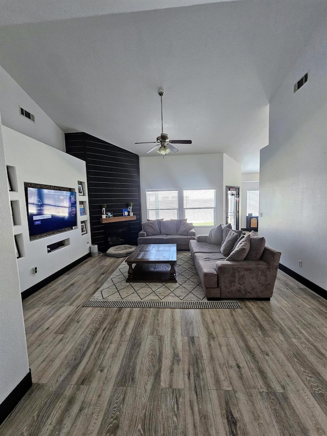 5453 N San Clemente Ave, Fresno, CA 93723 - living room featuring vaulted ceiling, wood finished floors, a ceiling fan, and baseboards