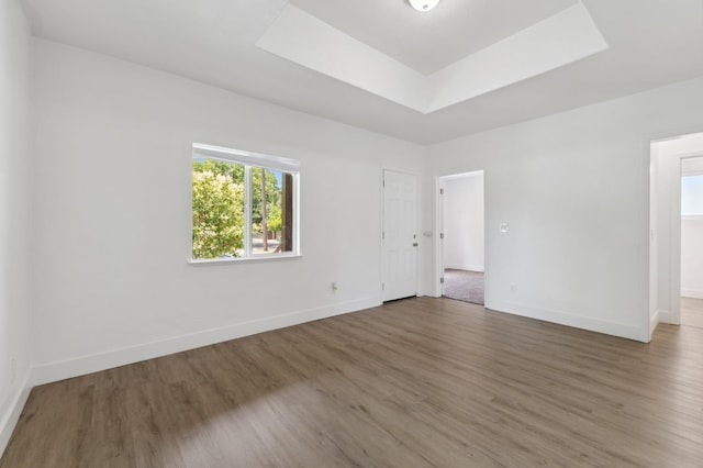 630 N Roosevelt Ave, Fresno, CA 93728 - spare room featuring wood finished floors, a raised ceiling, and baseboards