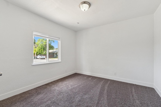 630 N Roosevelt Ave, Fresno, CA 93728 - unfurnished room featuring dark colored carpet and baseboards