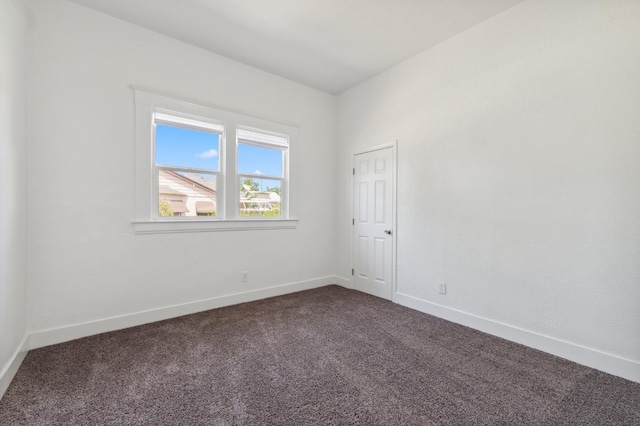 630 N Roosevelt Ave, Fresno, CA 93728 - empty room with dark colored carpet and baseboards