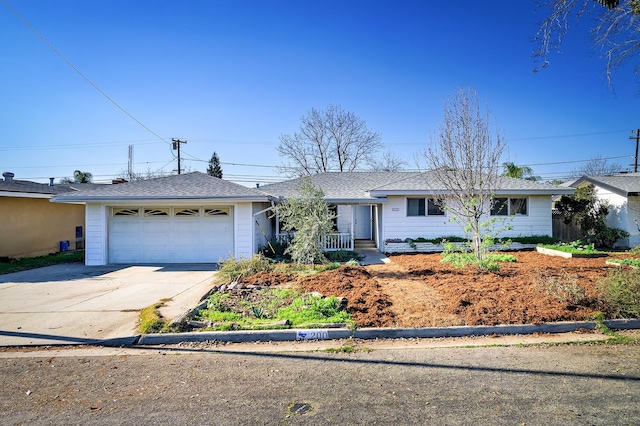 200 Autumn Rd, Madera, CA 93637 - ranch-style home featuring a garage, concrete driveway, covered porch, and roof with shingles