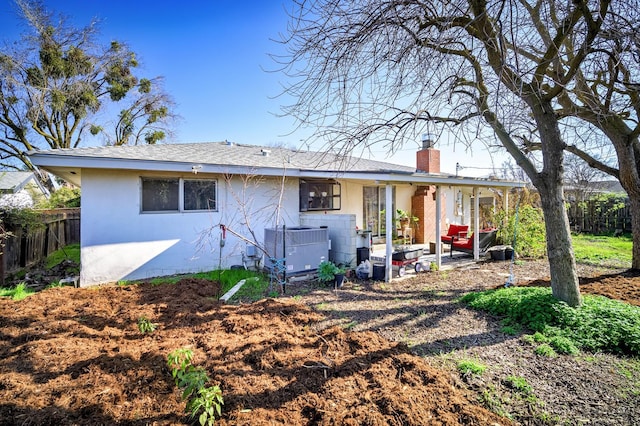 200 Autumn Rd, Madera, CA 93637 - rear view of house with a chimney, stucco siding, central AC unit, and a patio area