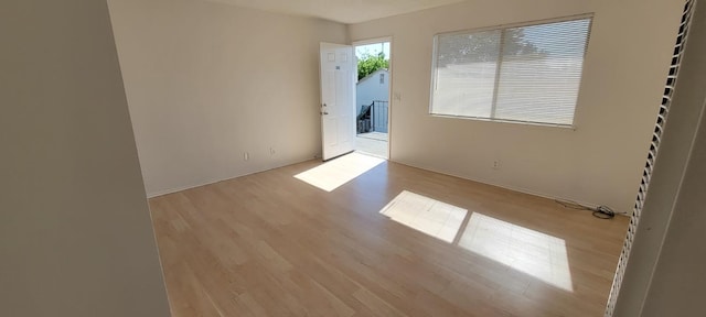 2025 E White Ave, Fresno, CA 93701 - spare room with wood finished floors and baseboards