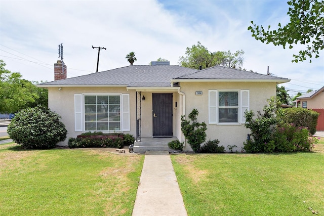 2994 E Cornell Ave, Fresno, CA 93703 - bungalow with a front lawn, stucco siding, a chimney, and roof with shingles