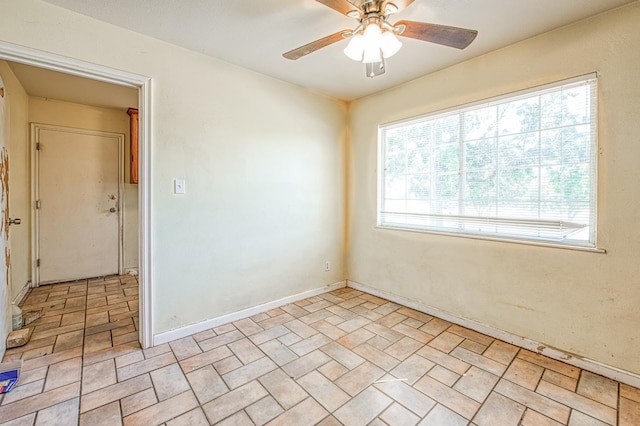 7820 N Fancher Rd, Clovis, CA 93619 - unfurnished room with ceiling fan, baseboards, and brick patterned flooring