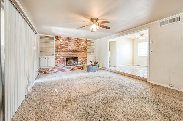 7820 N Fancher Rd, Clovis, CA 93619 - unfurnished living room featuring ceiling fan, carpet floors, built in shelves, and baseboards
