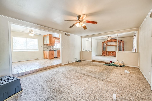 7820 N Fancher Rd, Clovis, CA 93619 - unfurnished living room with a ceiling fan, carpet, baseboards, and crown molding