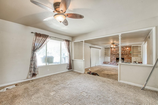 7820 N Fancher Rd, Clovis, CA 93619 - unfurnished bedroom with carpet flooring, baseboards, a fireplace, a textured ceiling, and ceiling fan