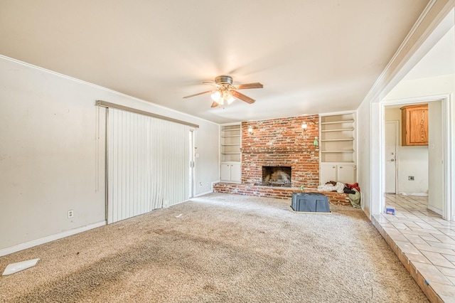 7820 N Fancher Rd, Clovis, CA 93619 - unfurnished living room with ceiling fan, built in features, light carpet, a fireplace, and baseboards
