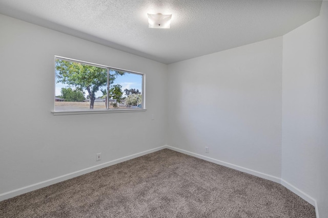 4824 E Brown Ave, Fresno, CA 93703 - empty room with carpet floors, a textured ceiling, and baseboards