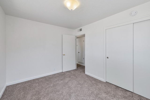 4824 E Brown Ave, Fresno, CA 93703 - unfurnished bedroom featuring carpet flooring, baseboards, and a closet