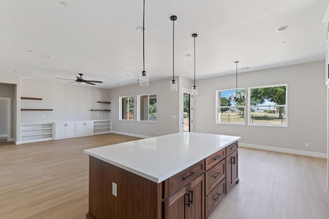 8440 Lake Shore Dr, Chowchilla, CA 93610 - kitchen with light wood-style flooring, a ceiling fan, a center island, and recessed lighting