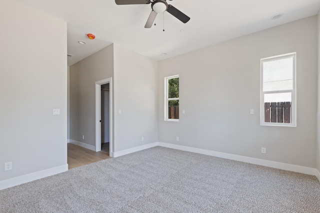8440 Lake Shore Dr, Chowchilla, CA 93610 - empty room with light colored carpet, ceiling fan, baseboards, and a smoke detector