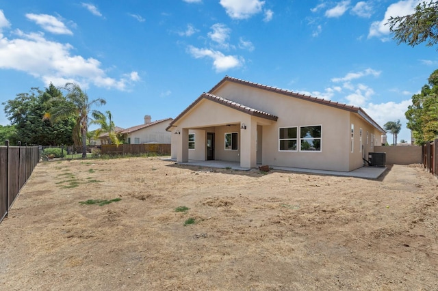 8440 Lake Shore Dr, Chowchilla, CA 93610 - back of property featuring central AC unit, a patio, a tile roof, stucco siding, and a fenced backyard