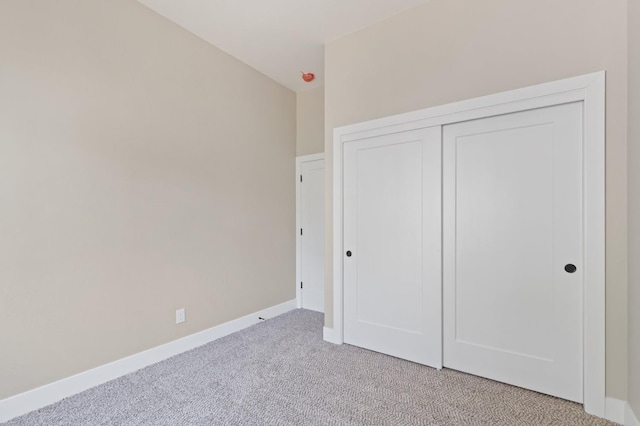 8440 Lake Shore Dr, Chowchilla, CA 93610 - unfurnished bedroom with light carpet, a closet, and baseboards