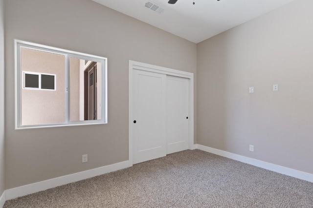 8440 Lake Shore Dr, Chowchilla, CA 93610 - unfurnished bedroom featuring carpet flooring, a closet, baseboards, and a ceiling fan