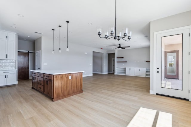 8385 Lake Shore Dr, Chowchilla, CA 93610 - kitchen featuring a ceiling fan, light wood finished floors, and light countertops