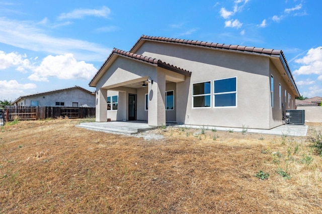 8385 Lake Shore Dr, Chowchilla, CA 93610 - rear view of house with a ceiling fan, central air condition unit, a patio, stucco siding, and a tile roof