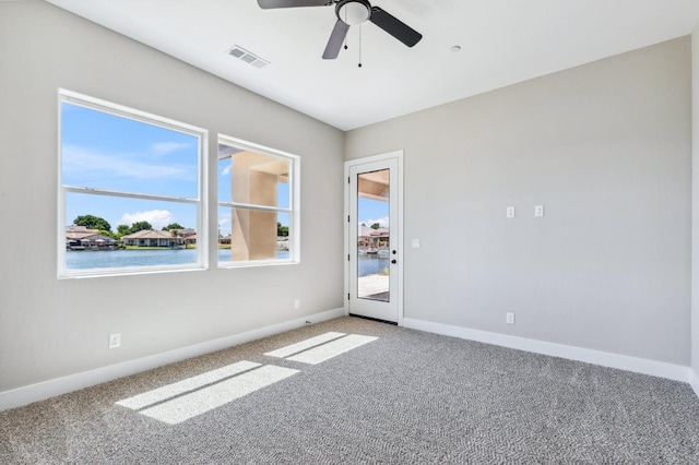 8385 Lake Shore Dr, Chowchilla, CA 93610 - unfurnished room featuring light colored carpet, a ceiling fan, and baseboards