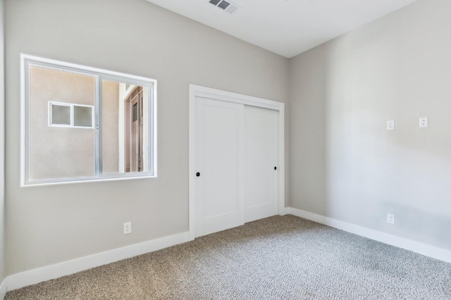 8385 Lake Shore Dr, Chowchilla, CA 93610 - unfurnished bedroom featuring carpet flooring, a closet, and baseboards