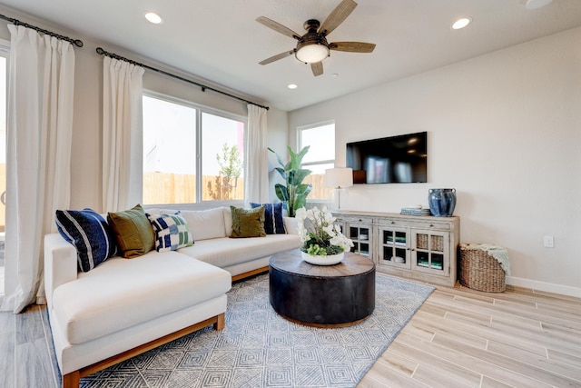 1151 Maclure Ave W, Madera, CA 93636 - living area featuring a ceiling fan, wood finished floors, recessed lighting, and baseboards