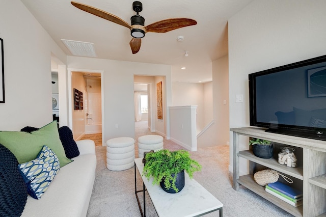 1151 Maclure Ave W, Madera, CA 93636 - carpeted living area featuring a ceiling fan and baseboards