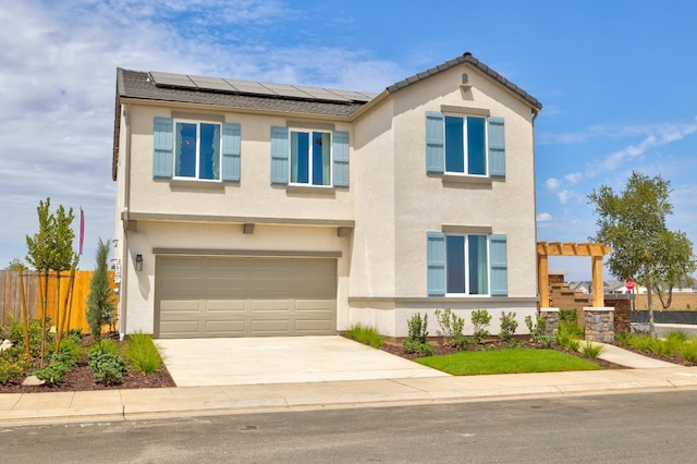 1151 Maclure Ave W, Madera, CA 93636 - view of front of property with roof mounted solar panels, concrete driveway, and stucco siding