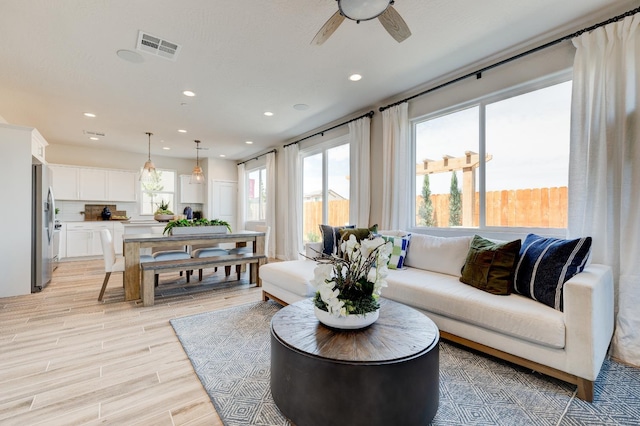 1151 Maclure Ave W, Madera, CA 93636 - living room featuring a ceiling fan, recessed lighting, and light wood finished floors