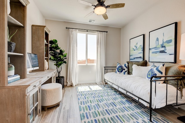 1151 Maclure Ave W, Madera, CA 93636 - living area with a ceiling fan, light wood-style floors, and baseboards