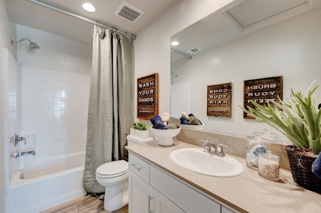 1151 Maclure Ave W, Madera, CA 93636 - full bathroom featuring vanity, shower / bath combo with shower curtain, toilet, recessed lighting, and wood finished floors