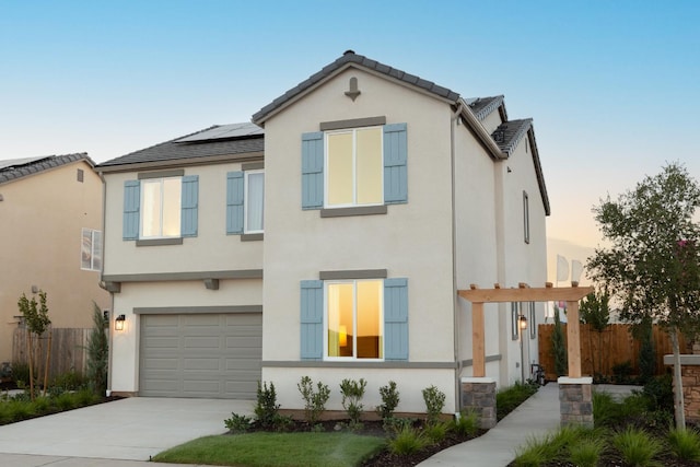 1151 Maclure Ave W, Madera, CA 93636 - view of front facade with stucco siding, a garage, and driveway