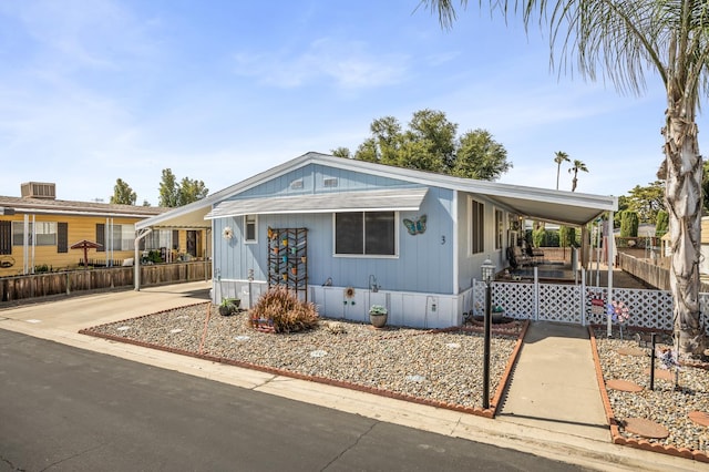 2627 W Midvalley, Visalia, CA 93277 - manufactured / mobile home with an attached carport and covered porch