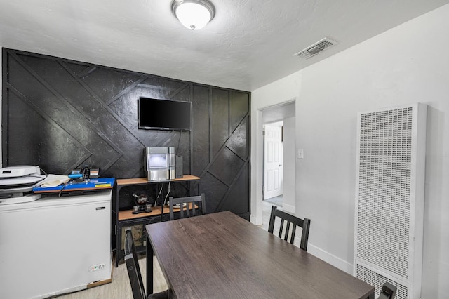 958 E Cornell Ave, Fresno, CA 93704 - dining area featuring a heating unit and wood finished floors