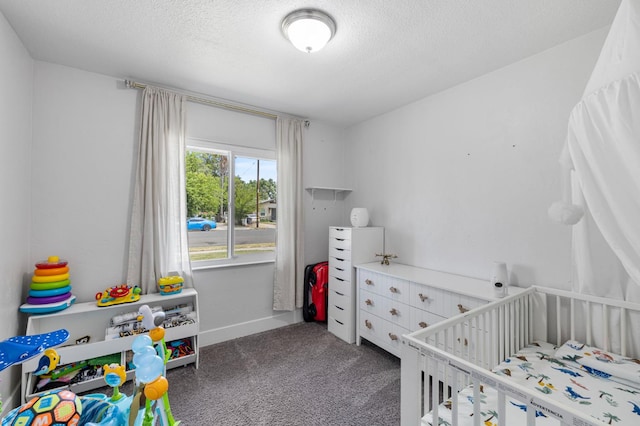 958 E Cornell Ave, Fresno, CA 93704 - carpeted bedroom with a nursery area, a textured ceiling, and baseboards
