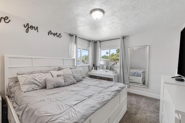 958 E Cornell Ave, Fresno, CA 93704 - bedroom with dark colored carpet, a textured ceiling, and baseboards