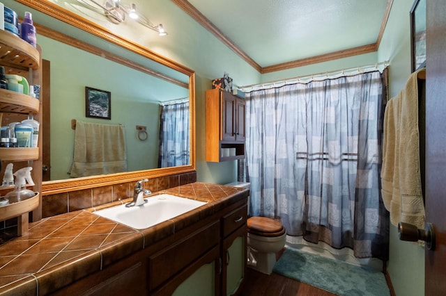 702 W Cortner Ave, Hanford, CA 93230 - full bath featuring toilet, vanity, crown molding, wood finished floors, and a shower with curtain