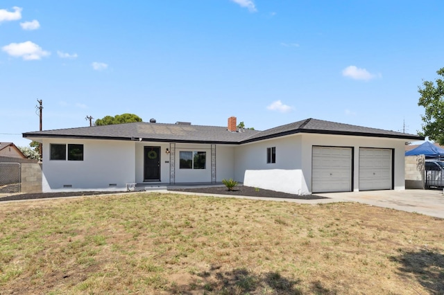 4641 E Weldon Ave, Fresno, CA 93703 - ranch-style house featuring a garage, driveway, stucco siding, and a chimney