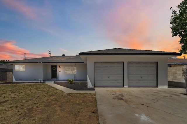 4641 E Weldon Ave, Fresno, CA 93703 - single story home with concrete driveway, a garage, and stucco siding